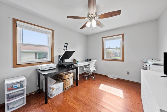 1529 Vogt Dr, West Bend, WI 53095 - office featuring light wood-style floors and a ceiling fan