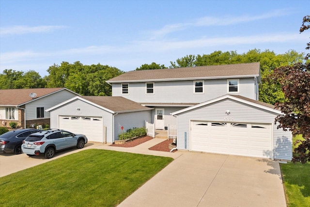 1529 Vogt Dr, West Bend, WI 53095 - view of front facade featuring a front lawn, driveway, and an outbuilding