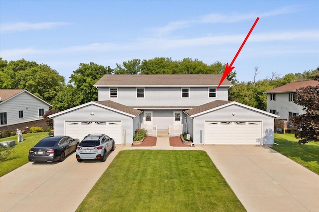 1529 Vogt Dr, West Bend, WI 53095 - traditional-style house featuring a garage, a front yard, and an outbuilding