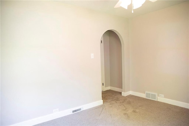 121 Pear St, Chippewa Falls, WI 54729 - unfurnished room featuring arched walkways, ceiling fan, light colored carpet, and baseboards