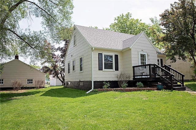 121 Pear St, Chippewa Falls, WI 54729 - bungalow with a shingled roof and a front yard