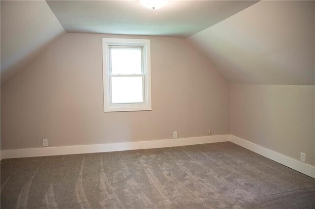 121 Pear St, Chippewa Falls, WI 54729 - additional living space featuring lofted ceiling, carpet, and baseboards
