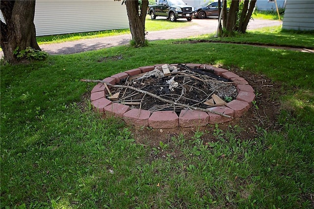 121 Pear St, Chippewa Falls, WI 54729 - view of green lawn featuring an outdoor fire pit