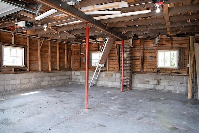 121 Pear St, Chippewa Falls, WI 54729 - garage with concrete block wall and a garage door opener