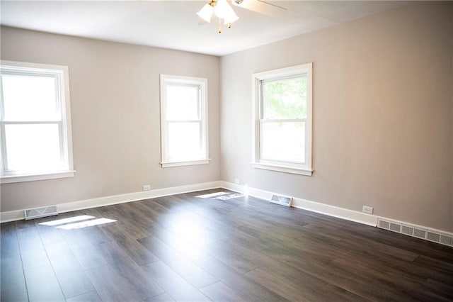 121 Pear St, Chippewa Falls, WI 54729 - empty room with a ceiling fan, dark wood-style floors, and baseboards