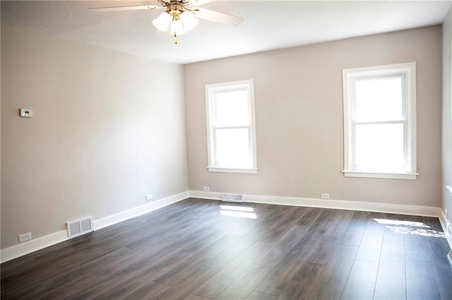 121 Pear St, Chippewa Falls, WI 54729 - spare room with ceiling fan, dark wood-style floors, and baseboards