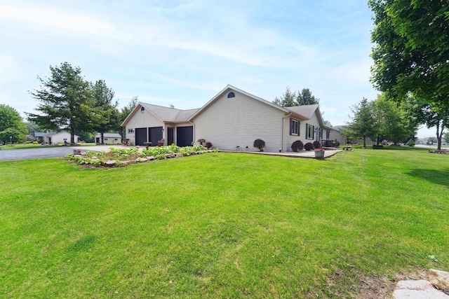 249 Donovan Cir, Rosendale, WI 54974 - view of home's exterior featuring an attached garage, asphalt driveway, and a yard