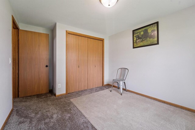 249 Donovan Cir, Rosendale, WI 54974 - unfurnished bedroom with carpet, a closet, and baseboards
