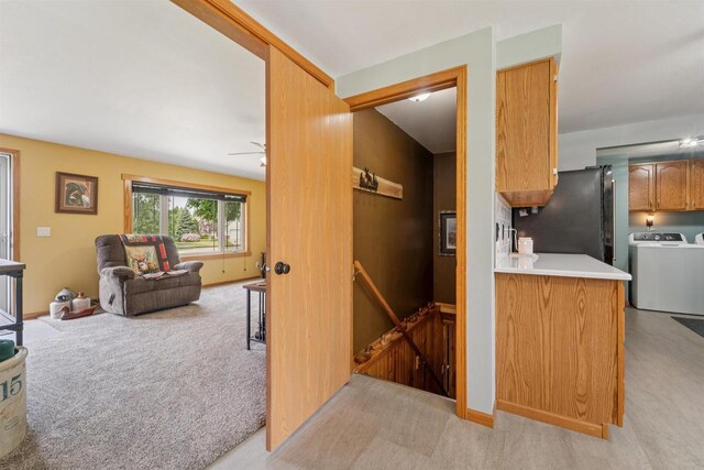 249 Donovan Cir, Rosendale, WI 54974 - kitchen featuring freestanding refrigerator, light colored carpet, open floor plan, light countertops, and ceiling fan