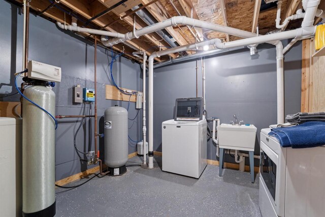 249 Donovan Cir, Rosendale, WI 54974 - unfinished basement featuring a water softener, a water pressure tank, washer and dryer, and a sink
