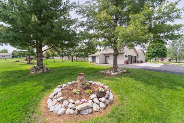 249 Donovan Cir, Rosendale, WI 54974 - view of green lawn with a detached garage