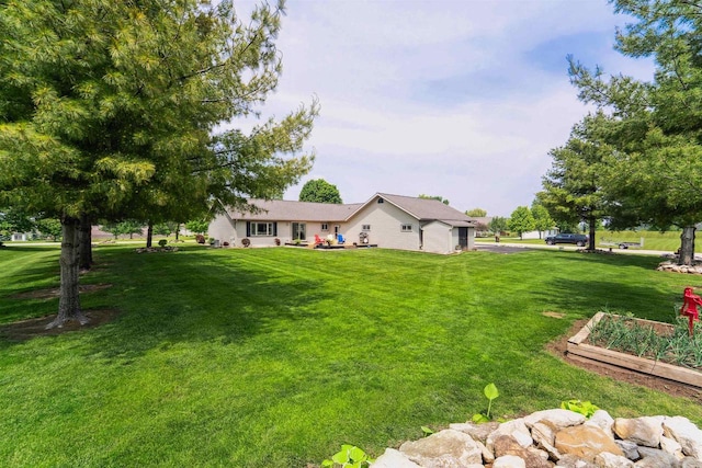 249 Donovan Cir, Rosendale, WI 54974 - view of grassy yard with a vegetable garden