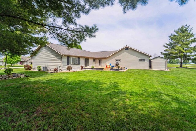249 Donovan Cir, Rosendale, WI 54974 - back of property with a patio area, a lawn, and cooling unit