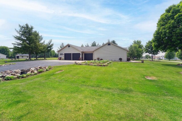 249 Donovan Cir, Rosendale, WI 54974 - view of front of house with driveway, an attached garage, and a front yard