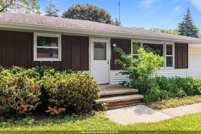 1636 S Driscoll St, Appleton, WI 54914 - view of front of home with board and batten siding and an attached garage