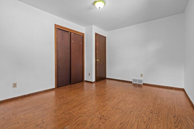 1636 S Driscoll St, Appleton, WI 54914 - unfurnished bedroom featuring wood finished floors and baseboards