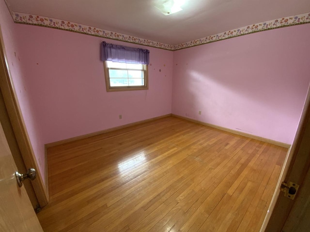 874 E Petunia Ln, Beloit, WI 53511 - unfurnished room featuring light wood-style flooring and baseboards