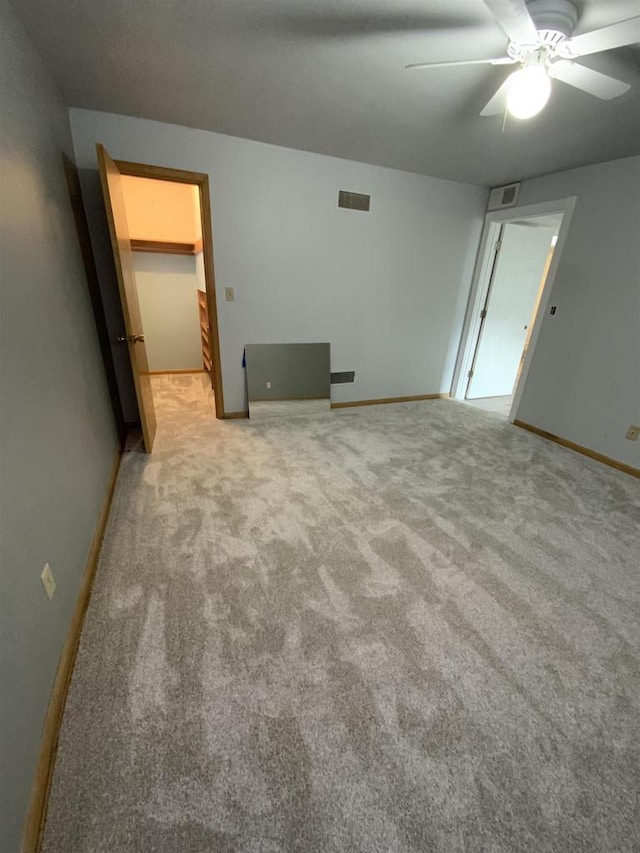 874 E Petunia Ln, Beloit, WI 53511 - spare room featuring light colored carpet and ceiling fan