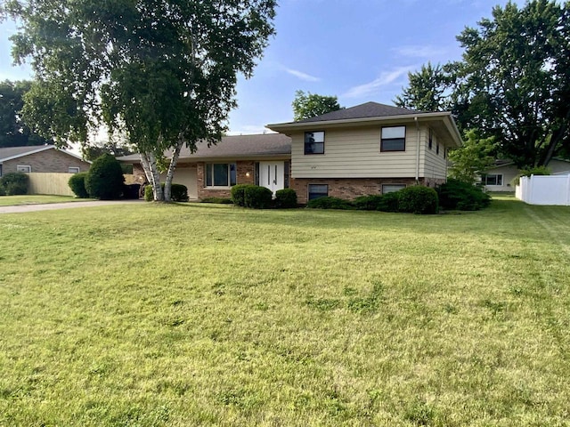 874 E Petunia Ln, Beloit, WI 53511 - tri-level home with a garage and brick siding