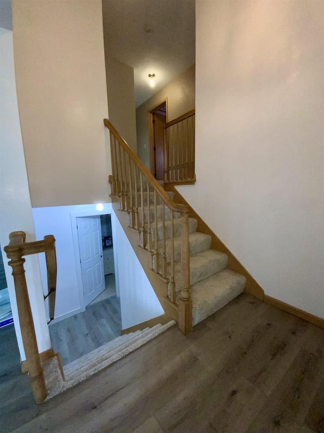 874 E Petunia Ln, Beloit, WI 53511 - staircase featuring wood finished floors and baseboards
