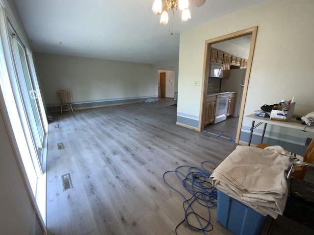 874 E Petunia Ln, Beloit, WI 53511 - living room featuring wood finished floors and ceiling fan