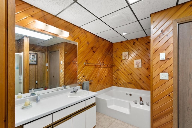 1251 Canyon Rd Unit 40, Wisconsin Dells, WI 53965 - bathroom featuring tile patterned floors, a bath, vanity, and wood walls