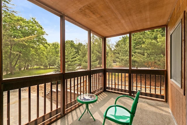 1251 Canyon Rd Unit 40, Wisconsin Dells, WI 53965 - unfurnished sunroom with view of wooded area