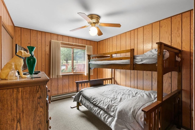 1251 Canyon Rd Unit 40, Wisconsin Dells, WI 53965 - carpeted bedroom with a baseboard radiator and wood walls