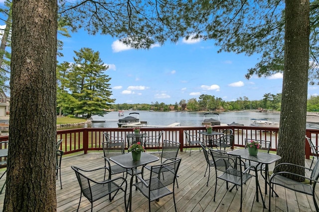 1251 Canyon Rd Unit 40, Wisconsin Dells, WI 53965 - wooden deck featuring outdoor dining area, a water view, and area for grilling