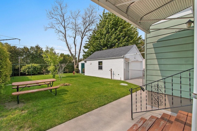 1013 28th St, Two Rivers, WI 54241 - view of green lawn featuring an outdoor structure and a garage