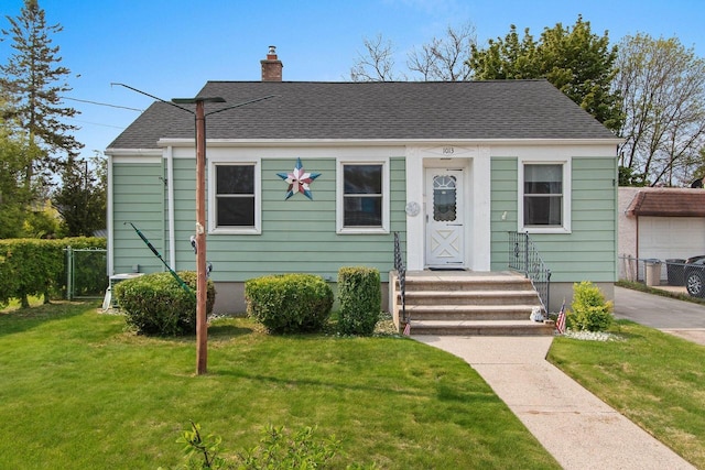 1013 28th St, Two Rivers, WI 54241 - bungalow-style home with a chimney and roof with shingles