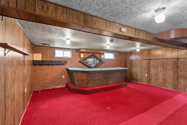 1013 28th St, Two Rivers, WI 54241 - indoor dry bar with wooden walls, carpet flooring, and brick wall