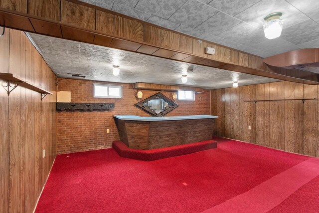 1013 28th St, Two Rivers, WI 54241 - indoor dry bar with wooden walls, carpet flooring, and brick wall