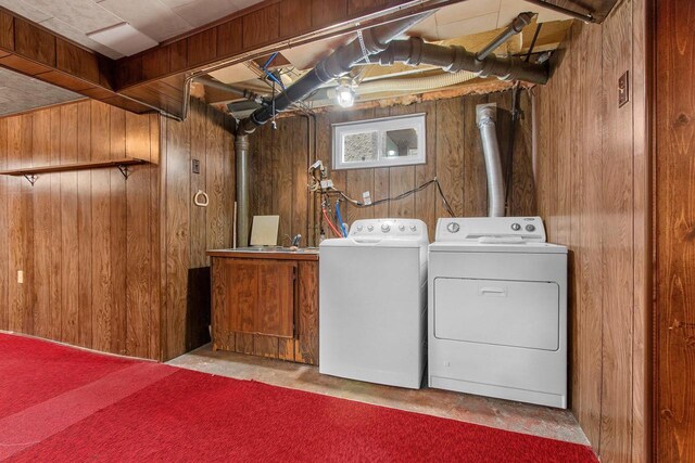 1013 28th St, Two Rivers, WI 54241 - laundry room with independent washer and dryer and wood walls