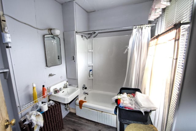 1033 S 11th St, Manitowoc, WI 54220 - full bathroom with shower / bath combination with curtain, wood finished floors, and a sink