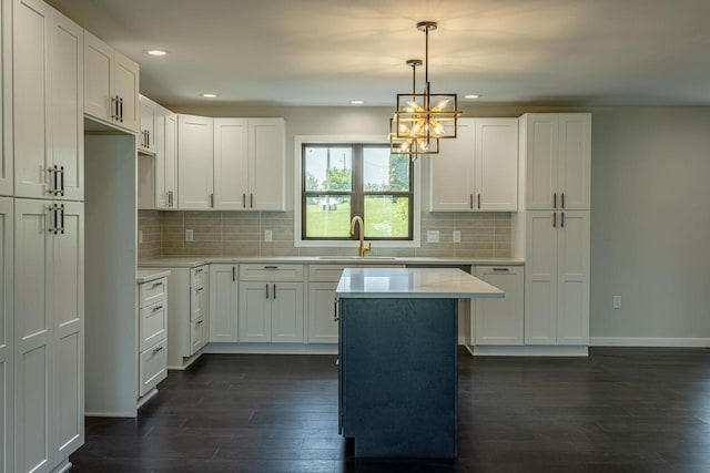 600 8th Ave, New Glarus, WI 53574 - kitchen featuring a sink, dark wood-style flooring, a chandelier, light countertops, and recessed lighting
