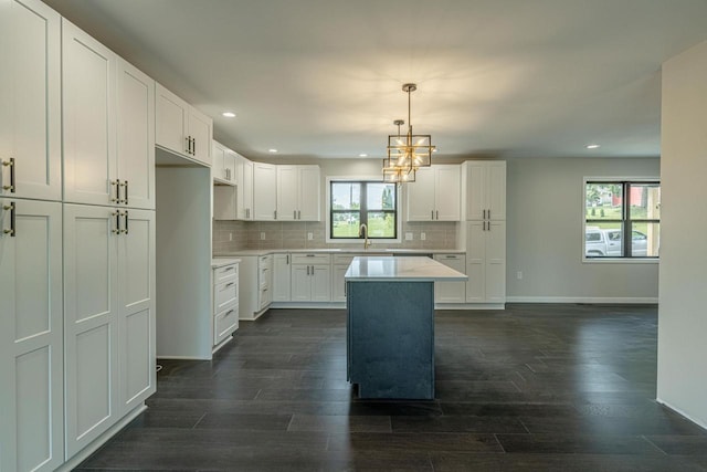 600 8th Ave, New Glarus, WI 53574 - kitchen featuring recessed lighting, a sink, dark wood-style floors, baseboards, and decorative backsplash