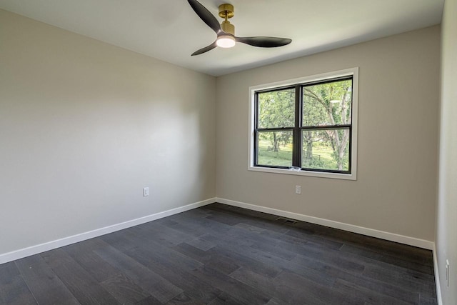 600 8th Ave, New Glarus, WI 53574 - empty room featuring dark wood-style floors, baseboards, and a ceiling fan