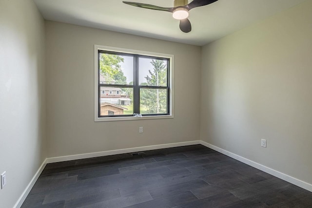 600 8th Ave, New Glarus, WI 53574 - unfurnished room with ceiling fan, baseboards, and dark wood-type flooring