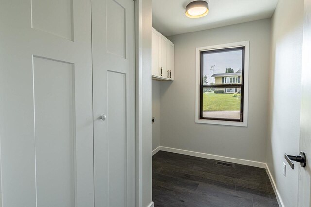 600 8th Ave, New Glarus, WI 53574 - laundry area with baseboards and dark wood-style flooring