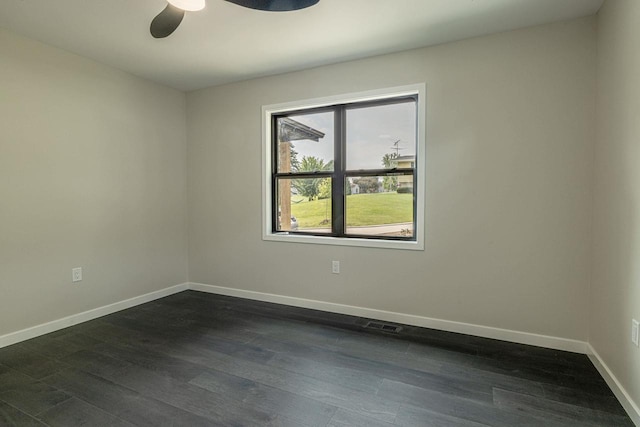 600 8th Ave, New Glarus, WI 53574 - spare room featuring baseboards, ceiling fan, and dark wood-style floors