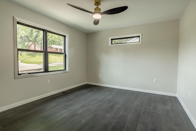 600 8th Ave, New Glarus, WI 53574 - spare room with dark wood-style floors, plenty of natural light, baseboards, and a ceiling fan