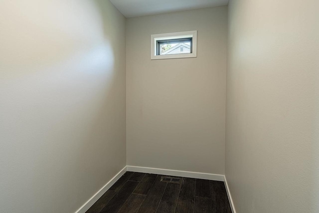 600 8th Ave, New Glarus, WI 53574 - unfurnished room featuring baseboards and dark wood-style flooring