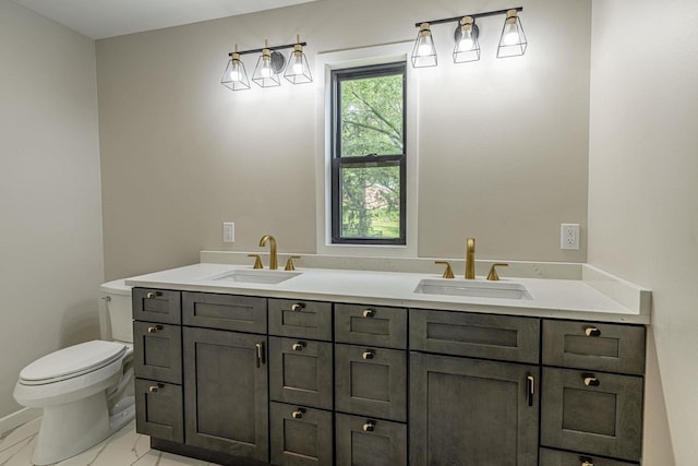 600 8th Ave, New Glarus, WI 53574 - bathroom with double vanity, toilet, and marble finish flooring