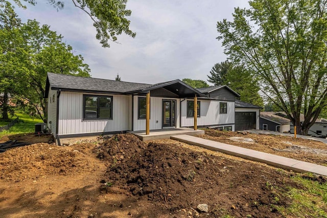 600 8th Ave, New Glarus, WI 53574 - modern farmhouse with an attached garage, central AC, and a shingled roof