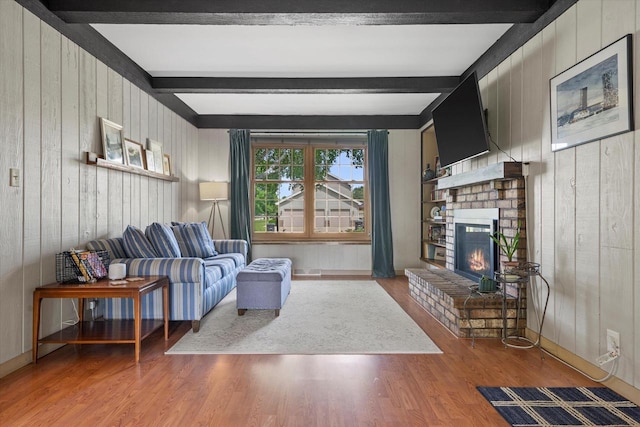 8317 S 42nd St, Franklin, WI 53132 - living area featuring beam ceiling, wood walls, wood finished floors, and a brick fireplace