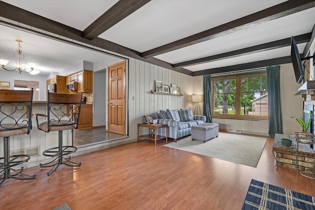 8317 S 42nd St, Franklin, WI 53132 - living area featuring wood finished floors, a chandelier, and beam ceiling