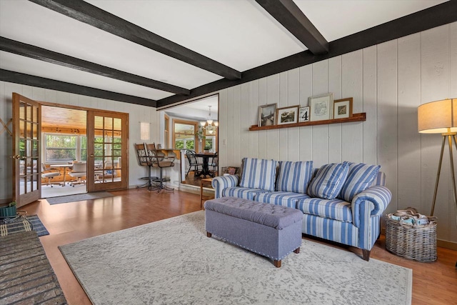 8317 S 42nd St, Franklin, WI 53132 - living area with wood finished floors, beam ceiling, a chandelier, french doors, and wood walls