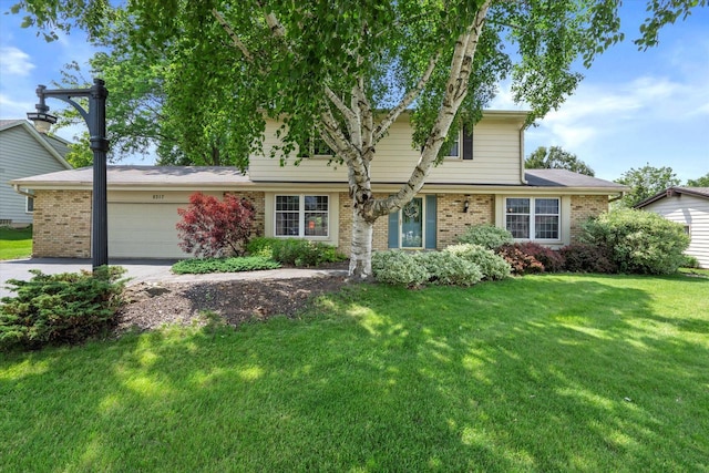 8317 S 42nd St, Franklin, WI 53132 - traditional home with brick siding, driveway, an attached garage, and a front lawn