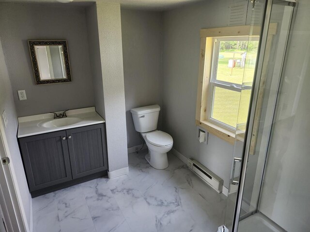 547 S Cambridge St, Wautoma, WI 54982 - bathroom featuring a baseboard radiator, marble look tile flooring, vanity, toilet, and a stall shower